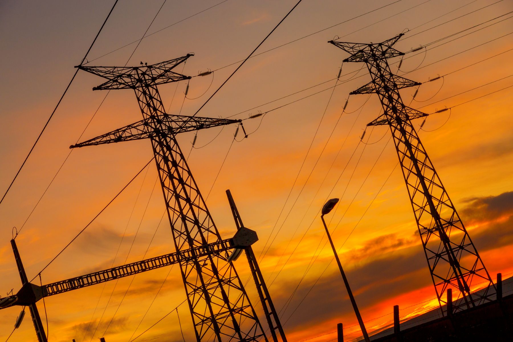 Electric transmission lines at sunset