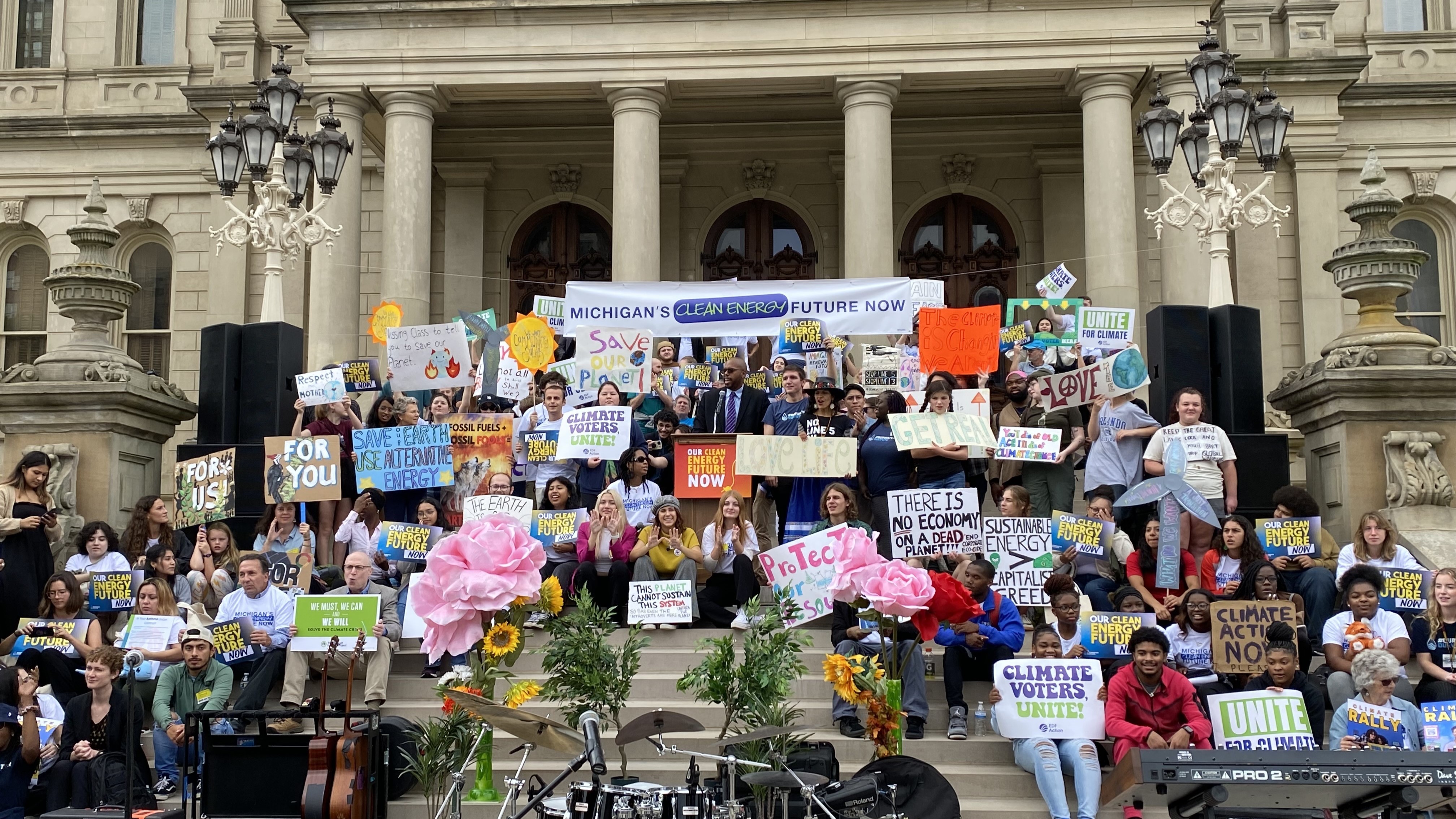 Michigan climate activists gathered on the steps of Michigan's capitol.