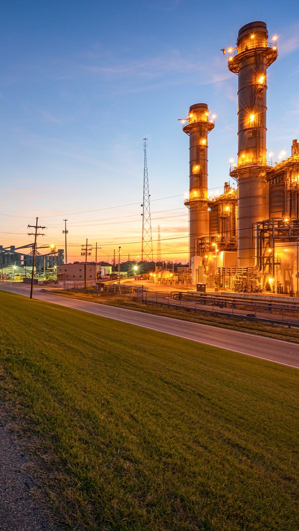 Gas power plant facility along a road
