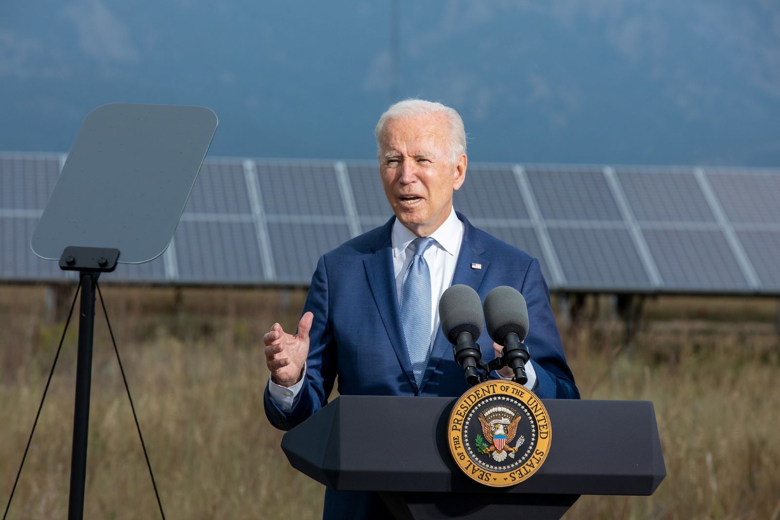 President Biden delivers a speech in front of an array of solar panels at the National Renewable Energy Lab in Colorado.
