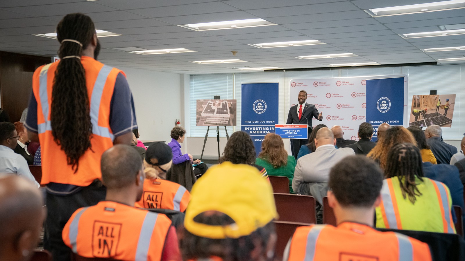 Local solar workers from the Chicago Urban League listen as EPA Administrator Michael Regan delivers remarks.