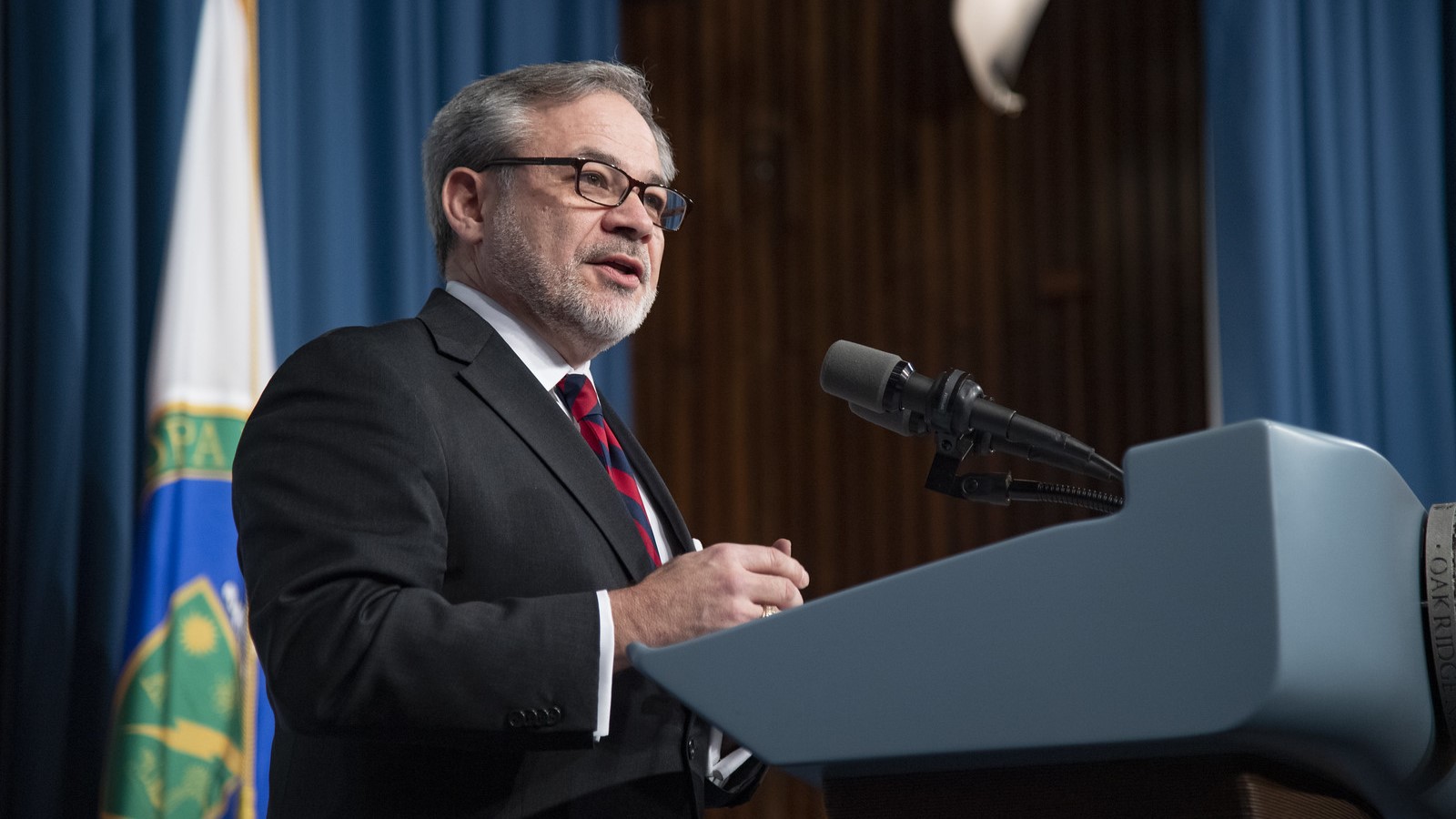 Dan Brouillette speaking at a podium.