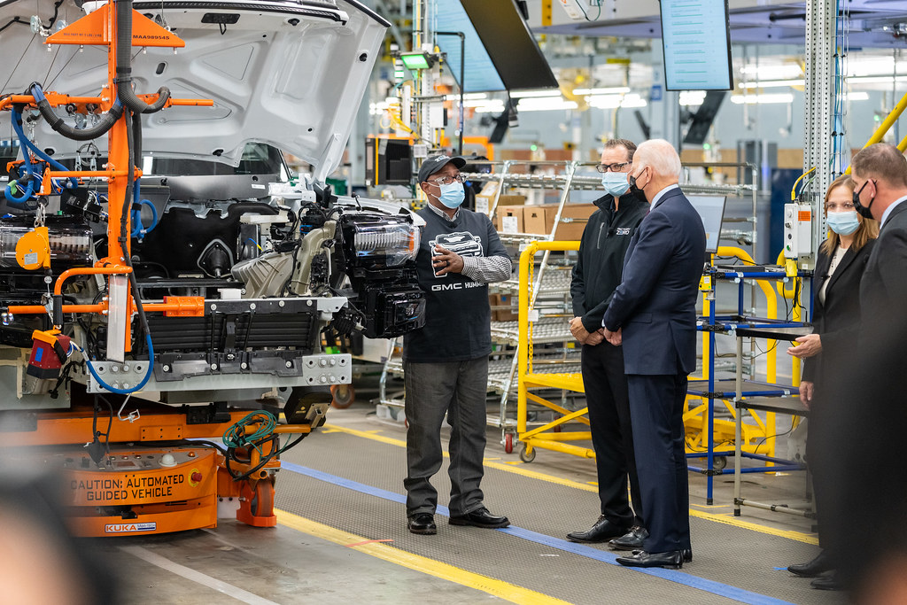 Hayward Miller, who works at the General Motors explains electrical testing and quality checks on EVs to President Biden at the Detroit, Michigan facility.