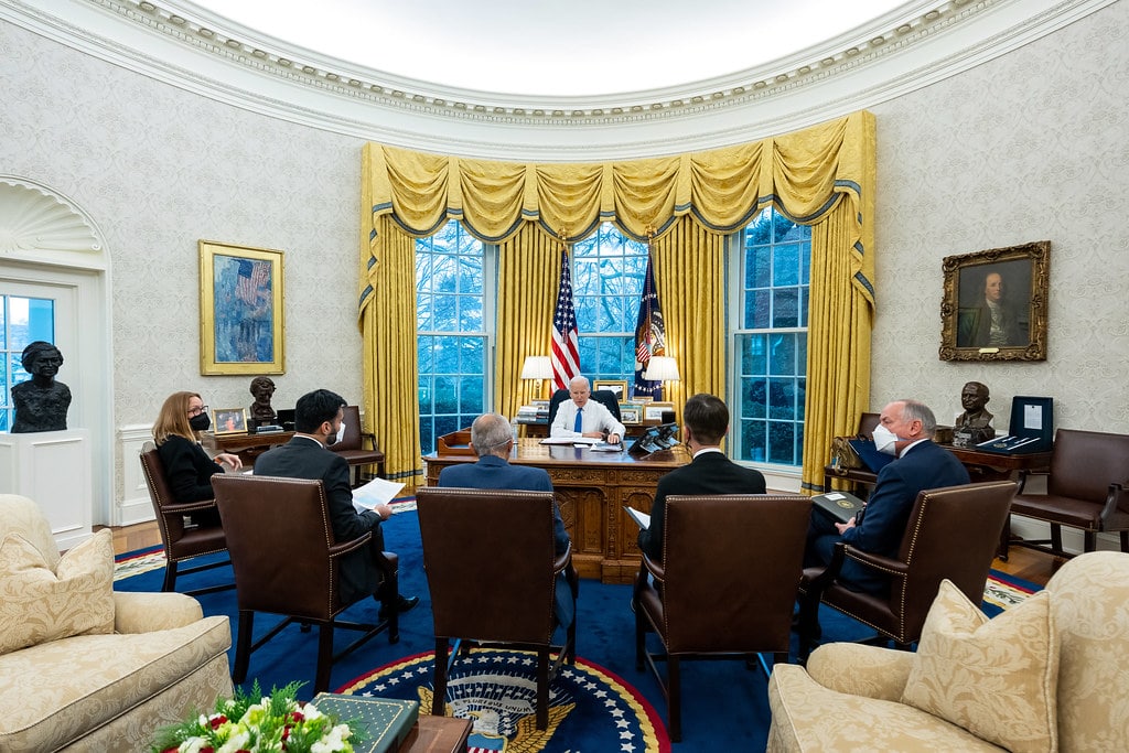 President Joe Biden meets with staff in the Oval Office to discuss the Willow Project. 