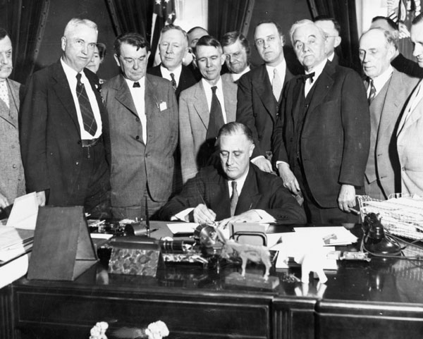 President Franklin D. Roosevelt signing the TVA Act in 1933.
