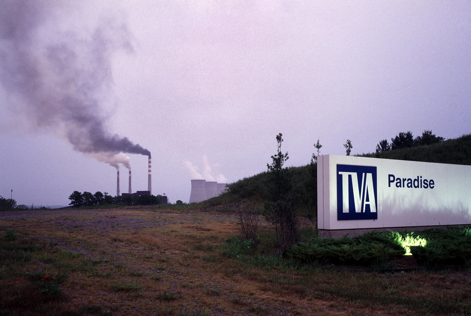 Coal power plant in the distance. A TVA sign that says