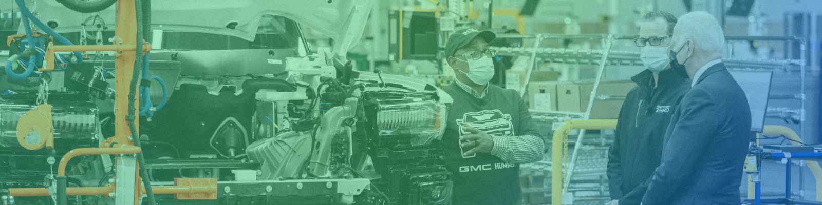 Man explaining what he does at an electric vehicle manufacturing facility.