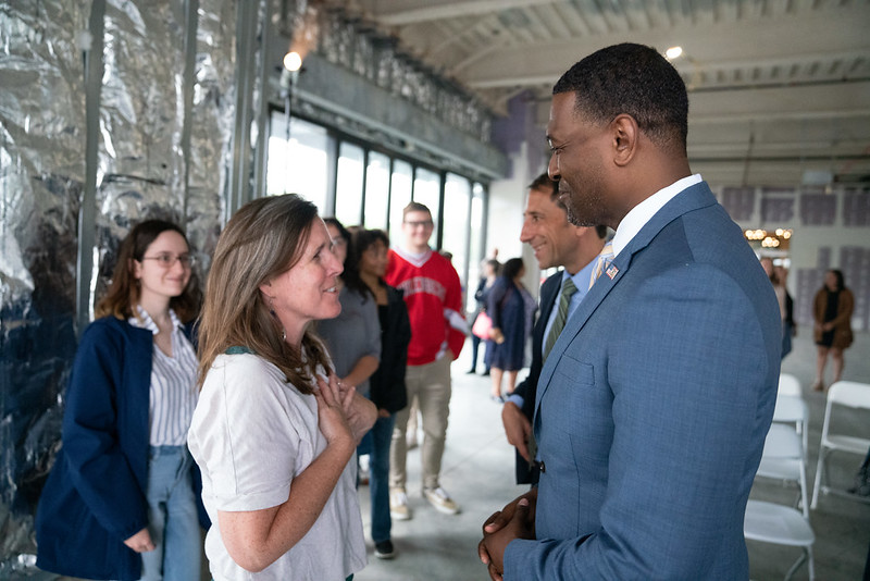EPA Michael Regan speaks with a woman in Pennsylvania at a CPRG event. 