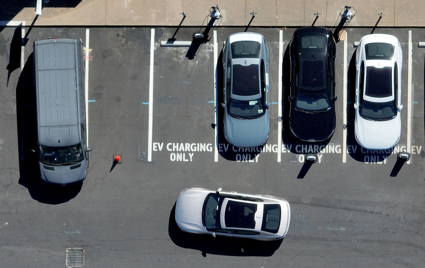 Overhead view of electric vehicle parking spots for charging