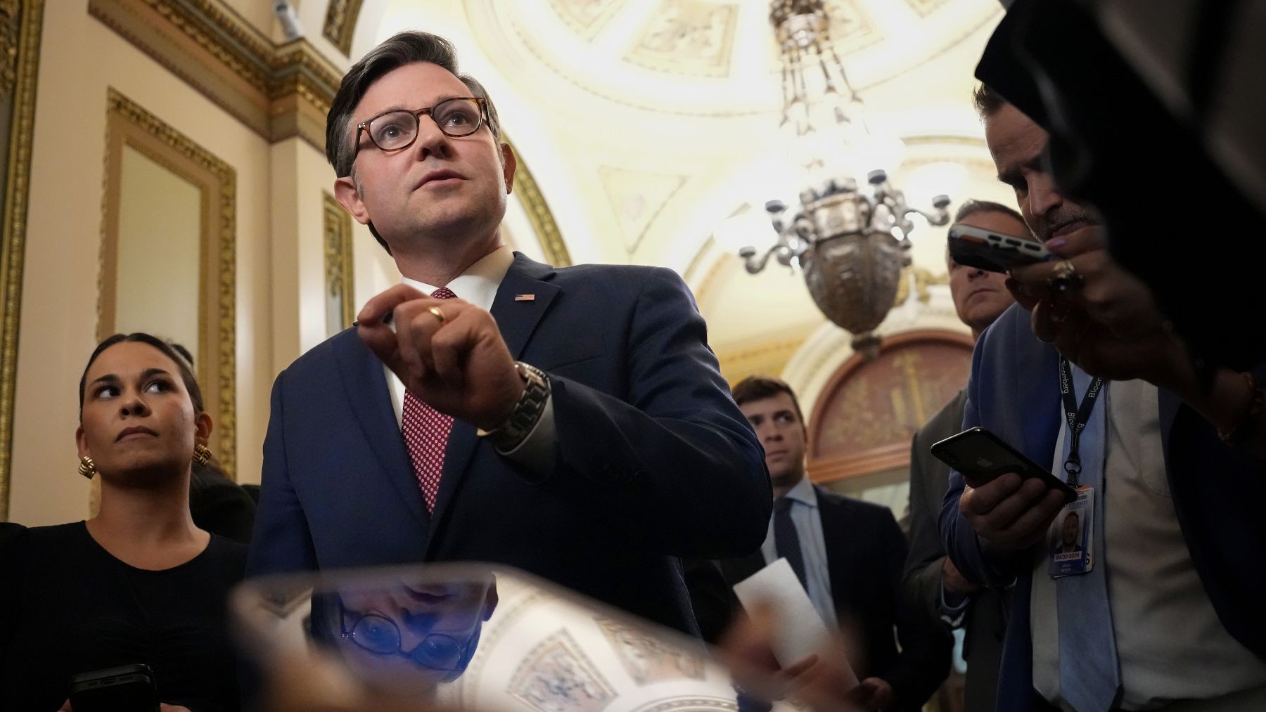 U.S. Speaker Mike Johnson speaks to reporters as he leaves the House Chamber at the U.S. Capitol.