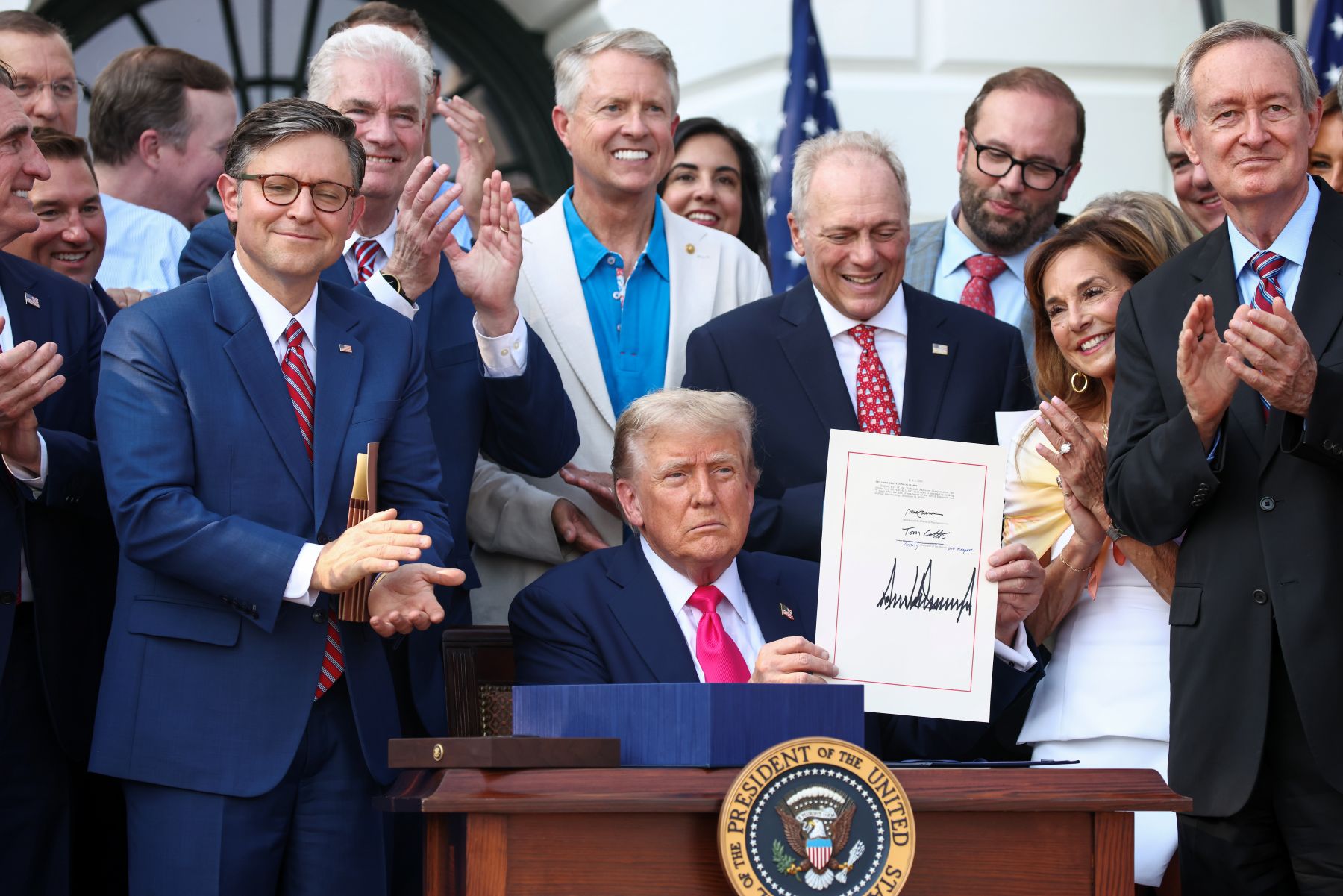 President Trump, joined by Republican lawmakers, signs the One Big Beautiful Bill Act into law